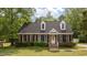 Charming brick home with a well-manicured lawn and classic black shutters at 160 Fox Run Rd, Youngsville, NC 27596