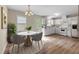 Inviting eat-in kitchen featuring modern finishes, a dining table, and abundant natural light at 160 Fox Run Rd, Youngsville, NC 27596