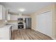 Clean kitchen with stainless steel appliances, hardwood floors, and ample cabinet space at 160 Fox Run Rd, Youngsville, NC 27596