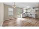 Bright eat-in kitchen featuring white cabinetry, modern appliances, and backyard access at 160 Fox Run Rd, Youngsville, NC 27596