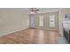 An inviting living room with a fireplace, large windows, and attractive flooring at 160 Fox Run Rd, Youngsville, NC 27596