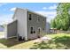 Back exterior featuring a two-story home, patio area, and gazebo at 162 W Lumber Ct, Clayton, NC 27520