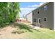 Backyard featuring home exterior and a wooden fence at 162 W Lumber Ct, Clayton, NC 27520
