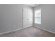 Neutral bedroom with a double door closet, and a sunny window at 162 W Lumber Ct, Clayton, NC 27520