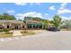 Inviting clubhouse exterior with awning-covered entrance, ample parking, and well-maintained grounds at 162 W Lumber Ct, Clayton, NC 27520