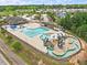 Aerial view of community water park showcasing pool, lazy river, water slide, and recreational area at 162 W Lumber Ct, Clayton, NC 27520