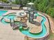 Aerial view of water park featuring winding lazy river and spiral staircase leading to water slide at 162 W Lumber Ct, Clayton, NC 27520
