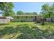 Backyard featuring green lawn and a wooden deck with an adjacent shed at 1708 S Alston Ave, Durham, NC 27707