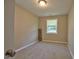 Bedroom offers neutral carpet, a window, and ample natural light at 1708 S Alston Ave, Durham, NC 27707