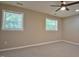 Bedroom showcasing two windows, a ceiling fan and neutral carpet at 1708 S Alston Ave, Durham, NC 27707