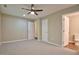 Bedroom featuring neutral colored walls, carpeting, and access to the bathroom at 1708 S Alston Ave, Durham, NC 27707