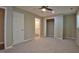 Spacious bedroom featuring neutral carpeting, a ceiling fan, and a closet at 1708 S Alston Ave, Durham, NC 27707