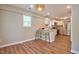 Charming dining area adjacent to a well-appointed kitchen with white cabinetry and a cozy breakfast bar at 1708 S Alston Ave, Durham, NC 27707