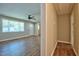 Open entryway boasts durable wood floors, a ceiling fan, and a bright front door at 1708 S Alston Ave, Durham, NC 27707
