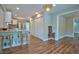 Open-concept kitchen flows seamlessly into the adjacent dining and living areas, ideal for modern living and entertaining at 1708 S Alston Ave, Durham, NC 27707