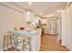 The kitchen features an eat-in breakfast bar with seating for two, complemented by modern appliances and pristine white cabinets at 1708 S Alston Ave, Durham, NC 27707
