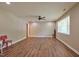 Spacious living room with hardwood floors, a ceiling fan, and natural light enhancing the inviting atmosphere at 1708 S Alston Ave, Durham, NC 27707