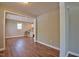 Open living space with hardwood floors and a view into the kitchen, creating a seamless flow for modern living at 1708 S Alston Ave, Durham, NC 27707