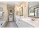 Spacious bathroom features a double vanity, white cabinets, soaking tub, and separate tiled shower at 1710 Eddy Ct, Franklinton, NC 27525
