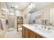 Bathroom with a double sink vanity, modern fixtures, and tile floors at 1710 Eddy Ct, Franklinton, NC 27525