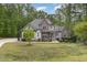 Beautiful home with a mix of stone and siding, complemented by a well-manicured front lawn at 1710 Eddy Ct, Franklinton, NC 27525