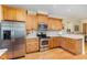 Bright kitchen features stainless steel appliances, granite countertops, custom cabinets and tile backsplash at 1710 Eddy Ct, Franklinton, NC 27525