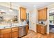This eat-in kitchen offers granite countertops, stainless appliances, tile backsplash, and wood cabinets at 1710 Eddy Ct, Franklinton, NC 27525