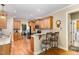 Charming eat-in kitchen features granite countertops, tile backsplash, stainless appliances, and hardwood floors at 1710 Eddy Ct, Franklinton, NC 27525