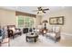 Inviting sitting room with natural light offers neutral walls, carpeting and a ceiling fan at 1710 Eddy Ct, Franklinton, NC 27525