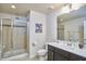 Modern bathroom with a glass-enclosed shower, double vanity, and contemporary finishes at 19 Sangre De Cristo Dr, Durham, NC 27705