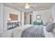Spacious bedroom featuring a tray ceiling, stylish decor, and ample natural light at 19 Sangre De Cristo Dr, Durham, NC 27705