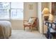 Inviting bedroom area with natural light, a cozy chair, and stylish decor at 19 Sangre De Cristo Dr, Durham, NC 27705