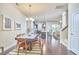 Open-concept dining area boasts hardwood floors, modern chandelier, and natural light, perfect for Gathering meals and entertaining at 19 Sangre De Cristo Dr, Durham, NC 27705