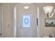 Bright entryway with stylish light fixture and view to living area at 19 Sangre De Cristo Dr, Durham, NC 27705
