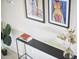 Chic hallway with modern art, a sleek console table, and a lush plant at 19 Sangre De Cristo Dr, Durham, NC 27705