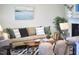 Comfortable living room with a neutral sofa, patterned rug, and stylish decorative accents at 19 Sangre De Cristo Dr, Durham, NC 27705