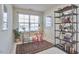 Bright office space featuring a wooden desk, red chair, bookshelf, and neutral walls at 19 Sangre De Cristo Dr, Durham, NC 27705
