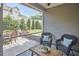 Inviting patio featuring a dining table, comfortable wicker chairs, and a well-manicured lawn at 19 Sangre De Cristo Dr, Durham, NC 27705