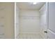 Spacious walk-in closet with carpet flooring and wire shelving for optimal storage and organization at 19 Sangre De Cristo Dr, Durham, NC 27705