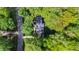 Aerial view of a secluded home nestled amidst lush trees, showcasing its private and serene setting at 202 Homestead Dr, Cary, NC 27513