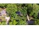 Stunning aerial view of a beautiful home surrounded by lush greenery and mature trees at 202 Homestead Dr, Cary, NC 27513