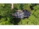 Aerial shot showcasing the property's expansive lot and surrounding lush landscape at 202 Homestead Dr, Cary, NC 27513