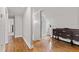 Charming attic space with hardwood floors, unique architecture, and a vintage dresser, creating a cozy atmosphere at 202 Homestead Dr, Cary, NC 27513