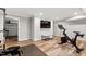 Basement fitness area with modern exercise equipment and a large television at 202 Homestead Dr, Cary, NC 27513