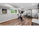 Basement fitness area with modern exercise equipment and a large window at 202 Homestead Dr, Cary, NC 27513