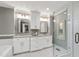 Modern bathroom with double vanities, glass shower, and mosaic tile accents at 202 Homestead Dr, Cary, NC 27513