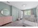 Bright Bedroom with neutral decor, carpet, crib, and natural light from windows at 202 Homestead Dr, Cary, NC 27513