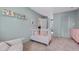 Comfortable Bedroom with serene decor, crib, chair, and soft natural light at 202 Homestead Dr, Cary, NC 27513