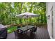 A deck offers an outdoor dining space and a grill, perfect for entertaining at 202 Homestead Dr, Cary, NC 27513