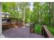 Spacious outdoor deck with seating, ideal for entertaining or enjoying the private, tree-filled backyard at 202 Homestead Dr, Cary, NC 27513